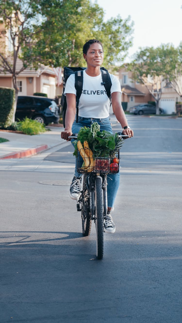 Delivery Person On A Bicycle