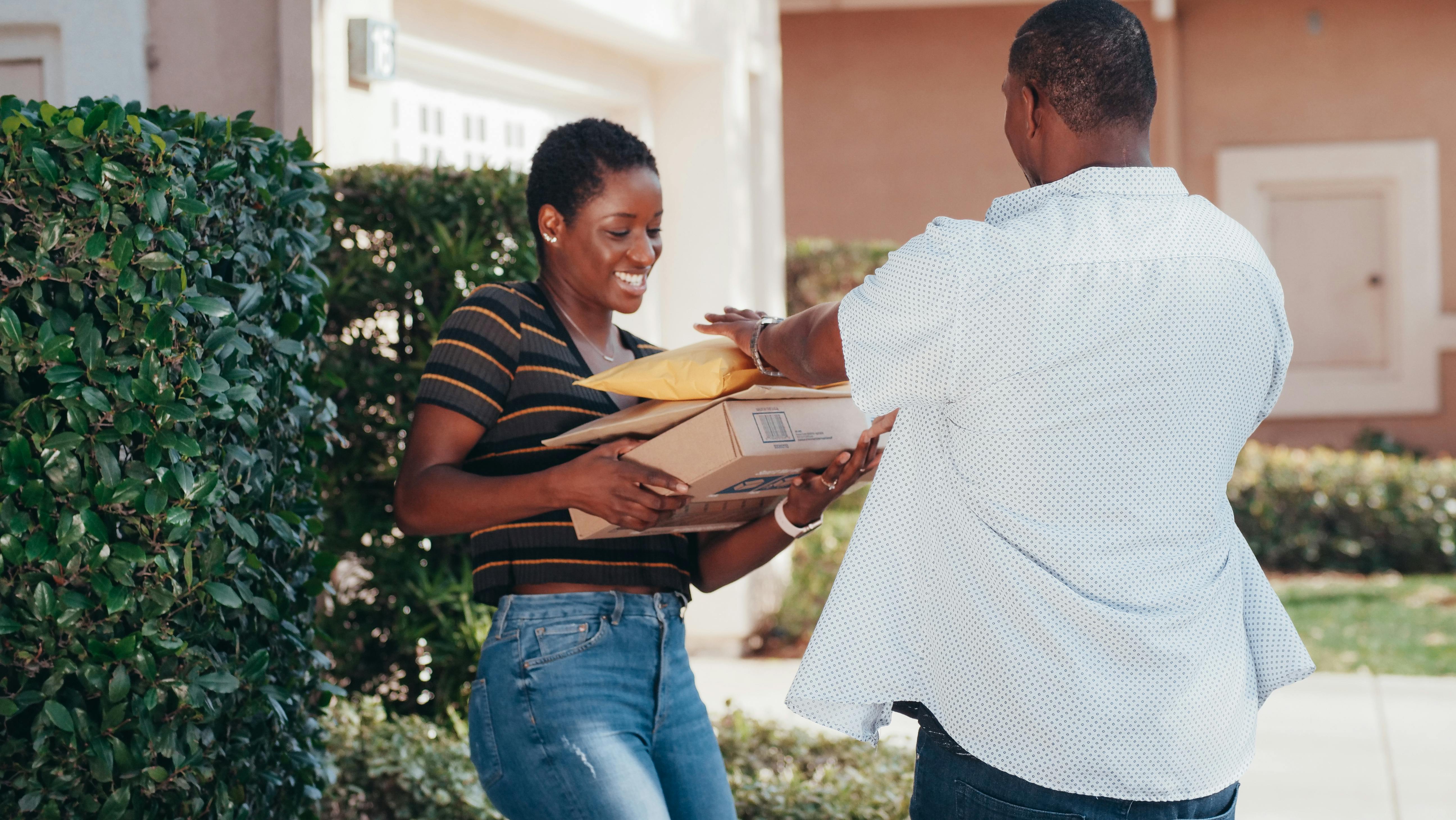 a woman receiving her delivered items