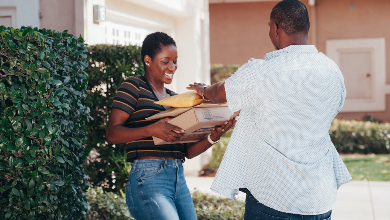 Free A Woman Receiving Her Delivered Items Stock Photo
