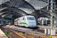 White and Green Train on Rail Tracks