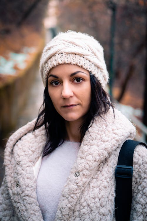 Woman Wearing White Knitted Cap and White Fur Coat