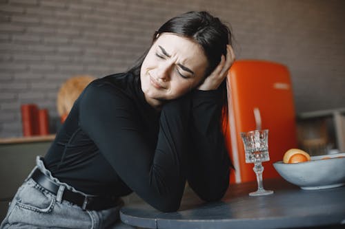 Free Woman in a Black Long Sleeve Top Crying Stock Photo