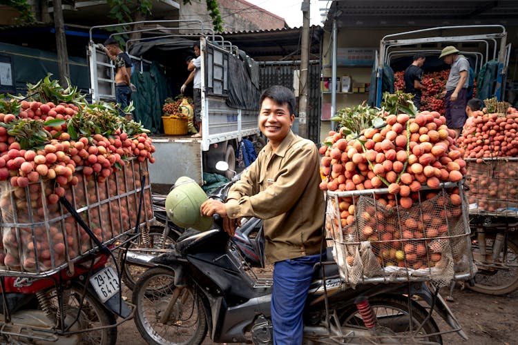 Man On Bike With Fruit Basket