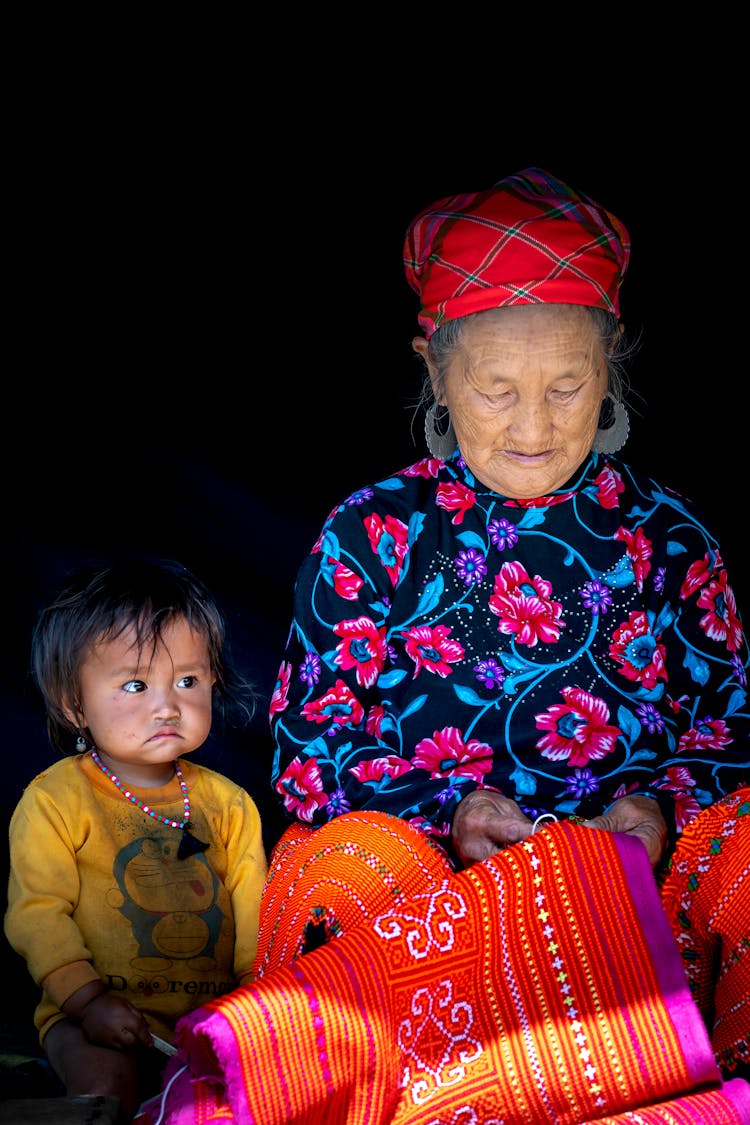 Portrait Of A Girl Sitting With Her Grandmother