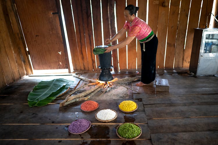 A Woman Cooking Traditional Delicacy