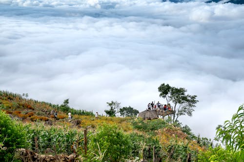 People on the View Deck on the Edge of a Mountain Cliff