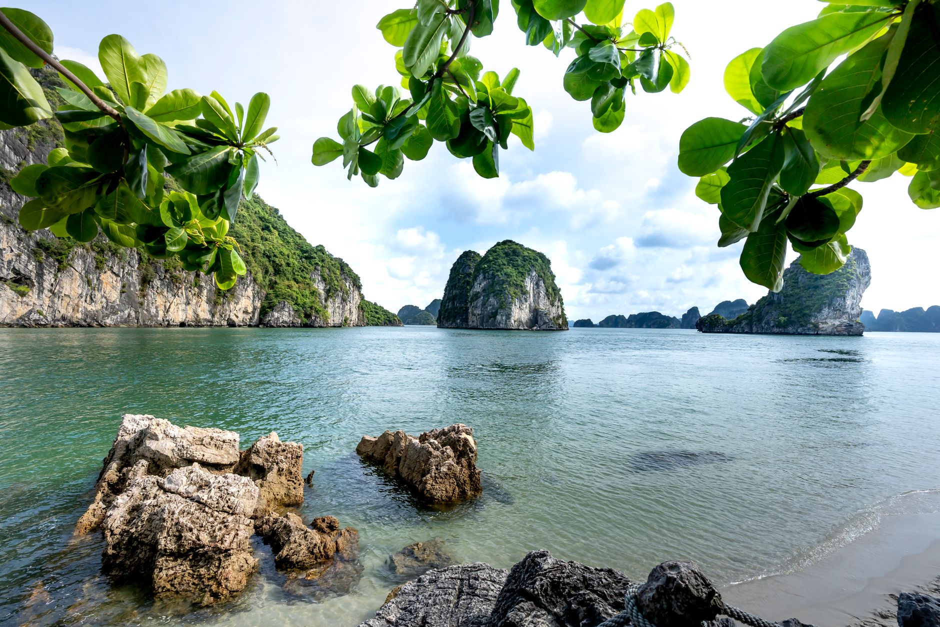 Tropical bay with limestone rocks and greenery, perfect for nature lovers.