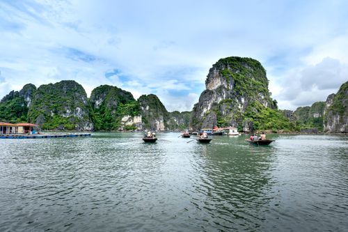 Free Tranquil scene of boats navigating the limestone karsts in beautiful Halong Bay, Vietnam. Stock Photo