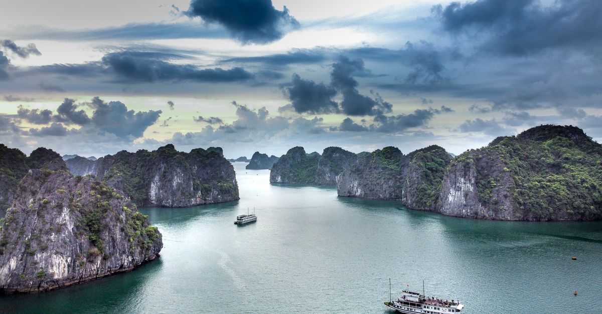 A breathtaking aerial view of boats navigating the scenic waters of Ha Long Bay, Vietnam.