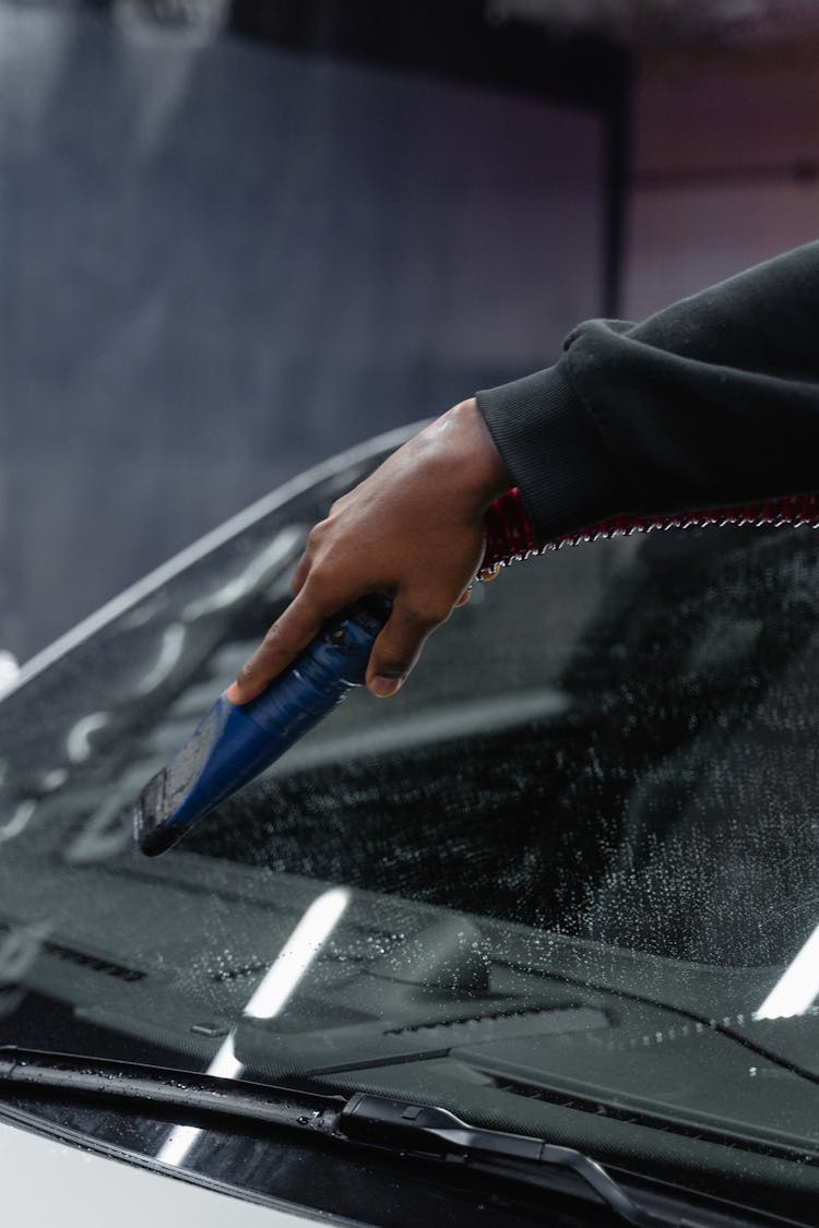 A Person Washing The Car