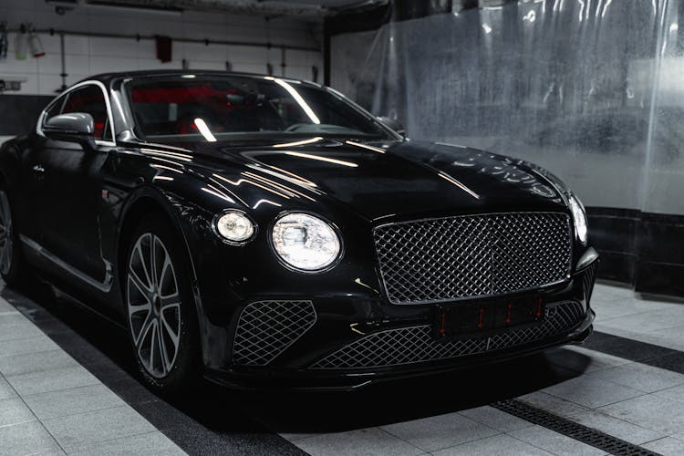 A Black Bentley Continental GT In A Car Wash