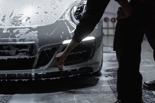 Free A Person Cleaning the Car Stock Photo