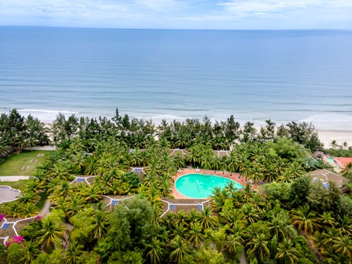 A Beautiful Beach Resort Surrounded by Green Trees