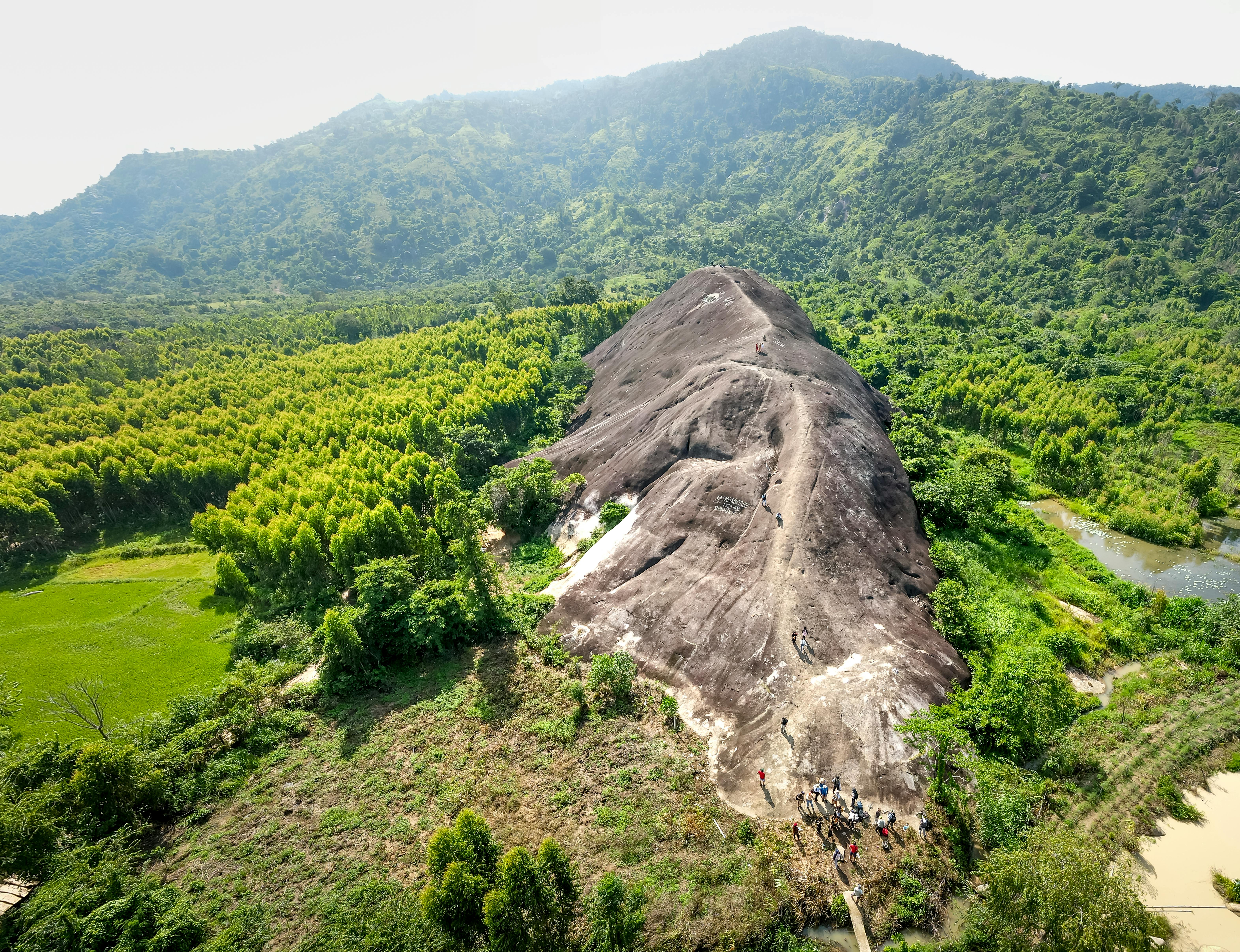 Breathtaking aerial shot of Mother Elephant Stone amidst lush greenery.