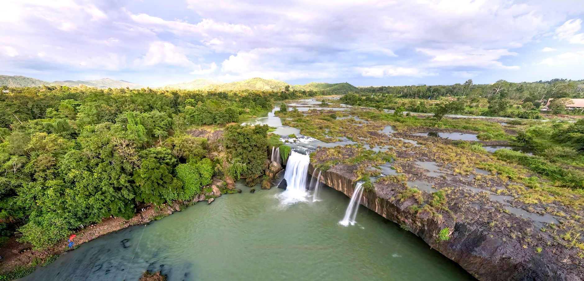 Breathtaking aerial view of Dray Nur Waterfall surrounded by lush greenery in Vietnam.
