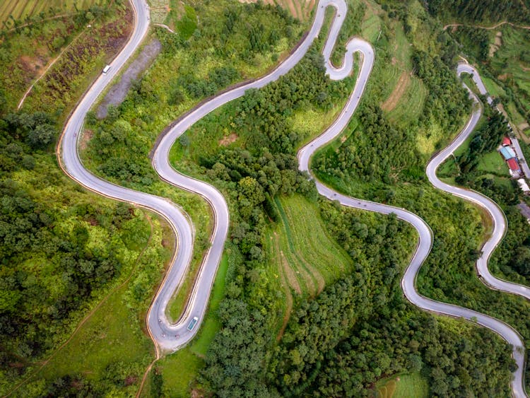 Curvy Road In Green Mountain Landscape