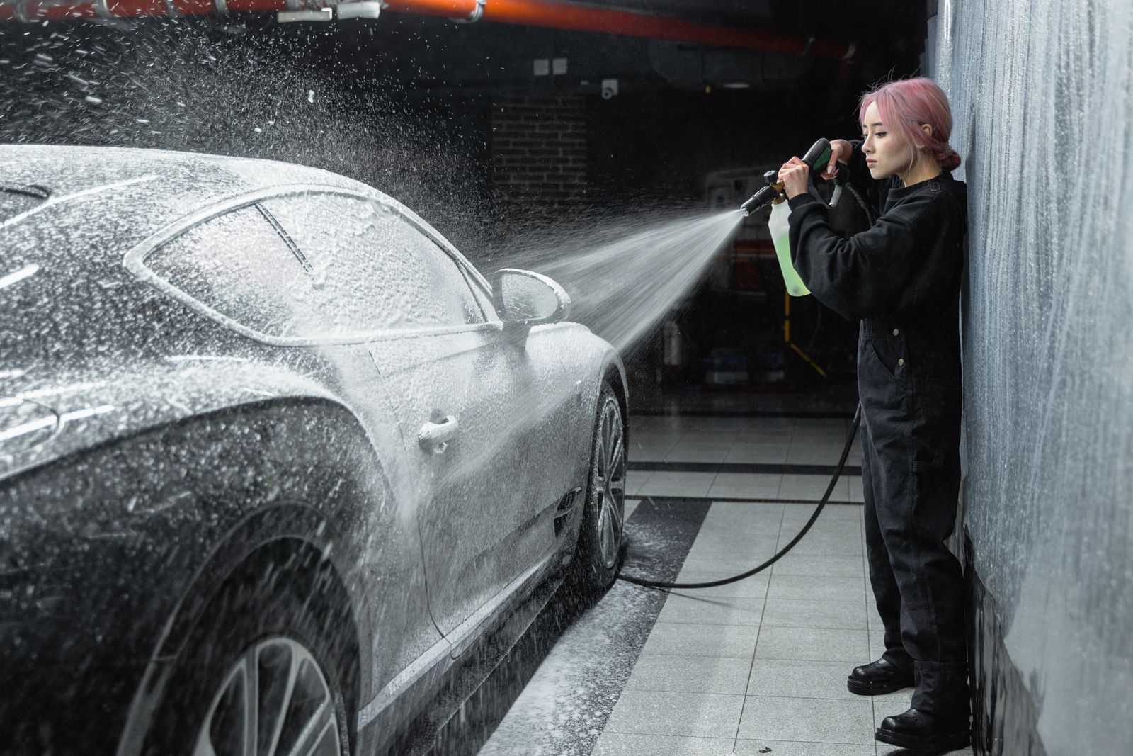 Foam and wash mitt on a car surface