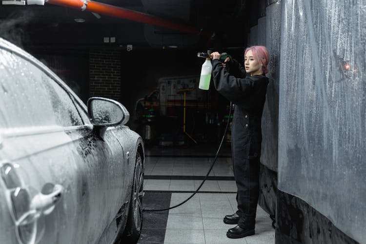 A Woman Washing A Car