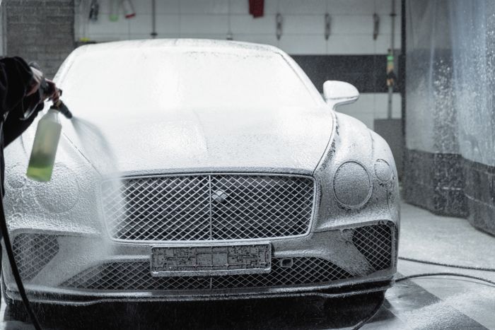 Car in foam inside the detailing garage