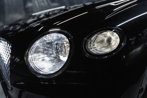 Luxury car headlight close-up after detailing