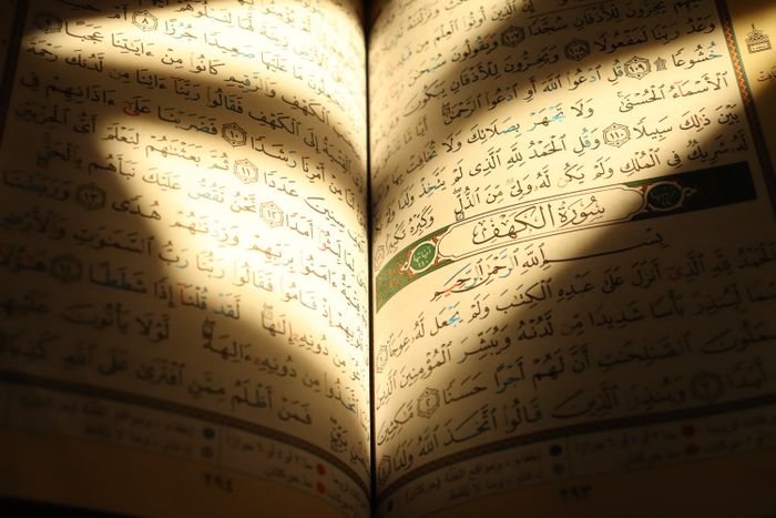 Arabic Quran text illuminated by sunlight