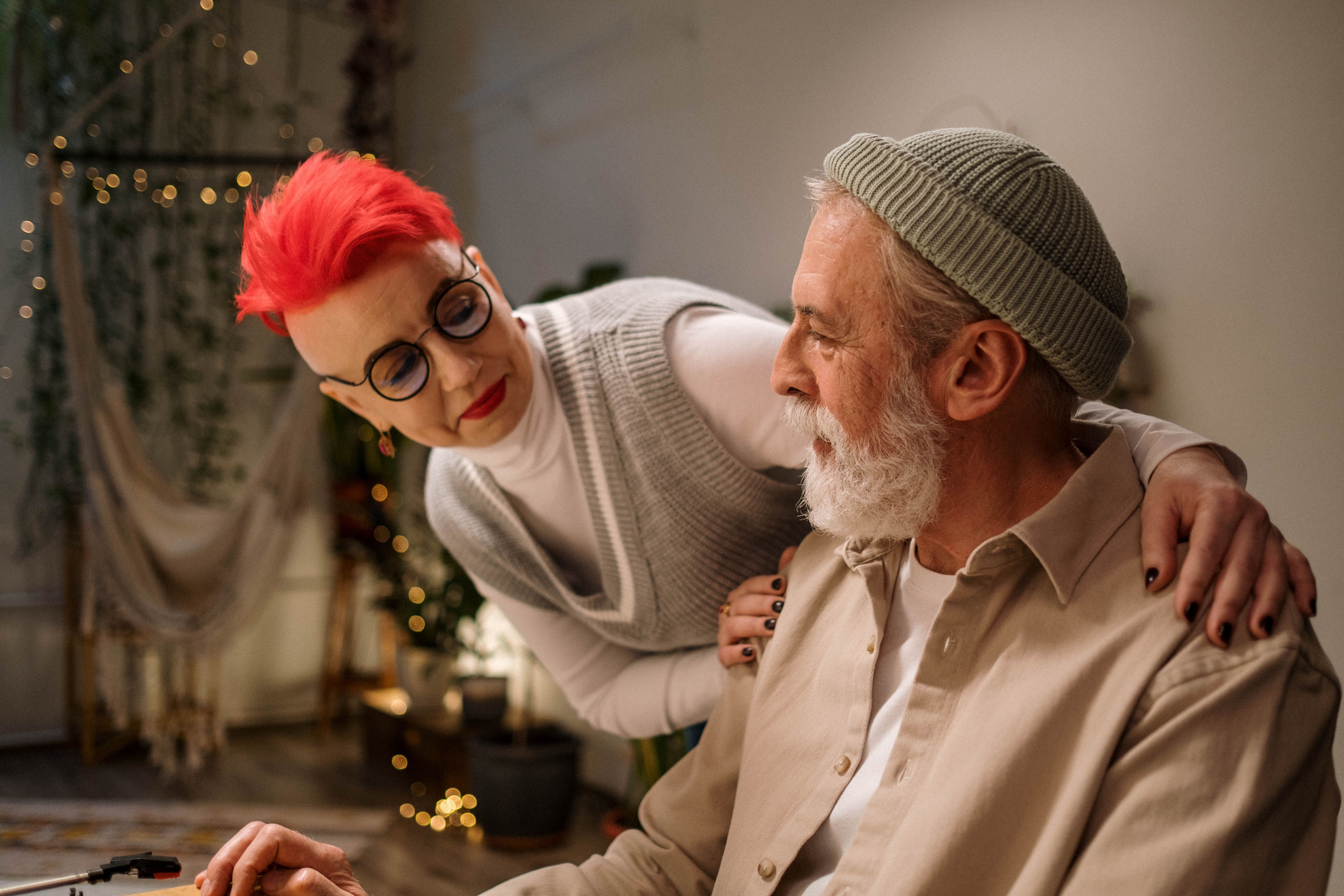 A stylish elderly couple enjoying a cozy moment indoors. Perfect for lifestyle and relationship themes.