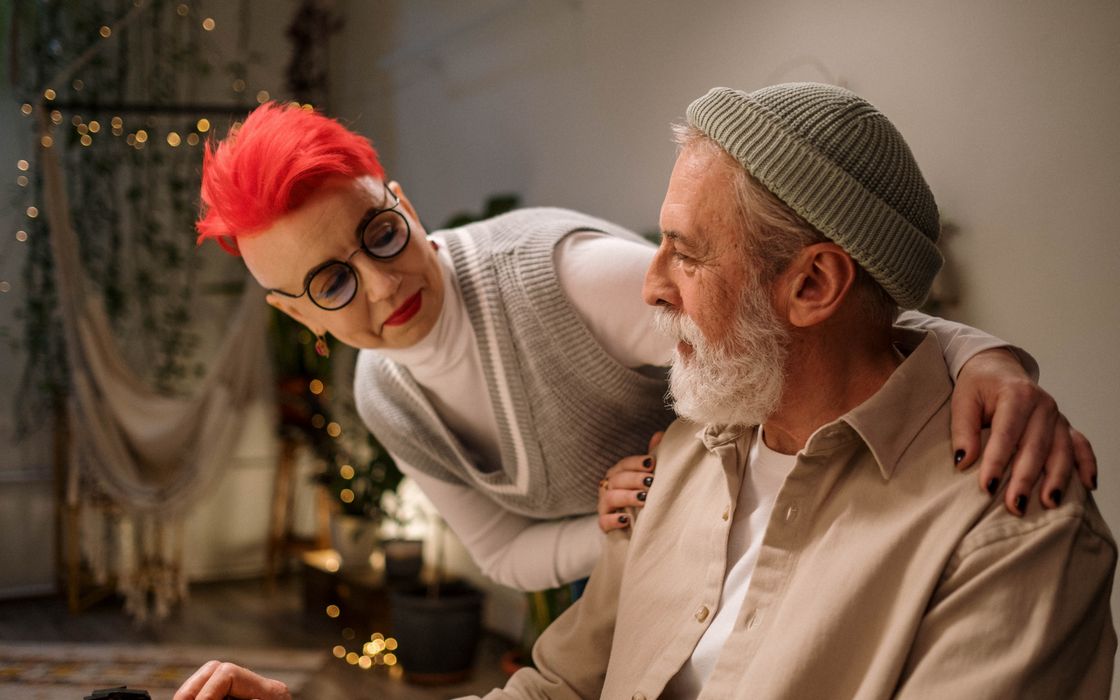 A stylish elderly couple enjoying a cozy moment indoors. Perfect for lifestyle and relationship themes.