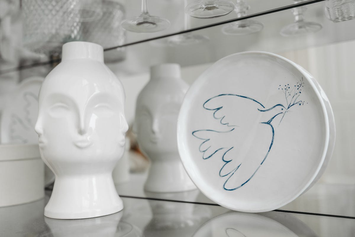 White Ceramic Display on the Glass Shelf
