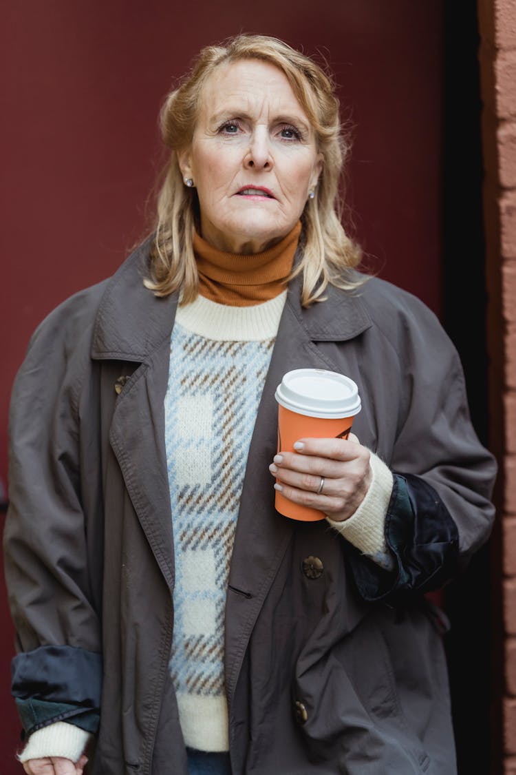 Elderly Woman With Coffee To Go On Street