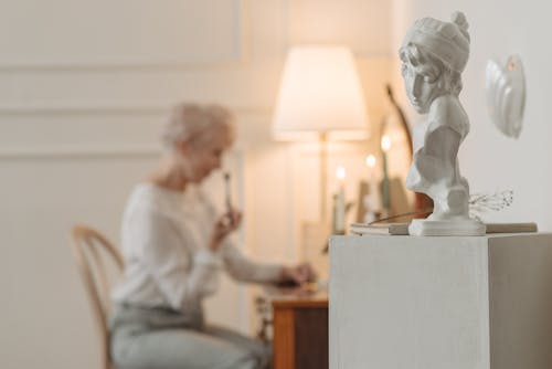 A Bust Sculpture over a Side Table