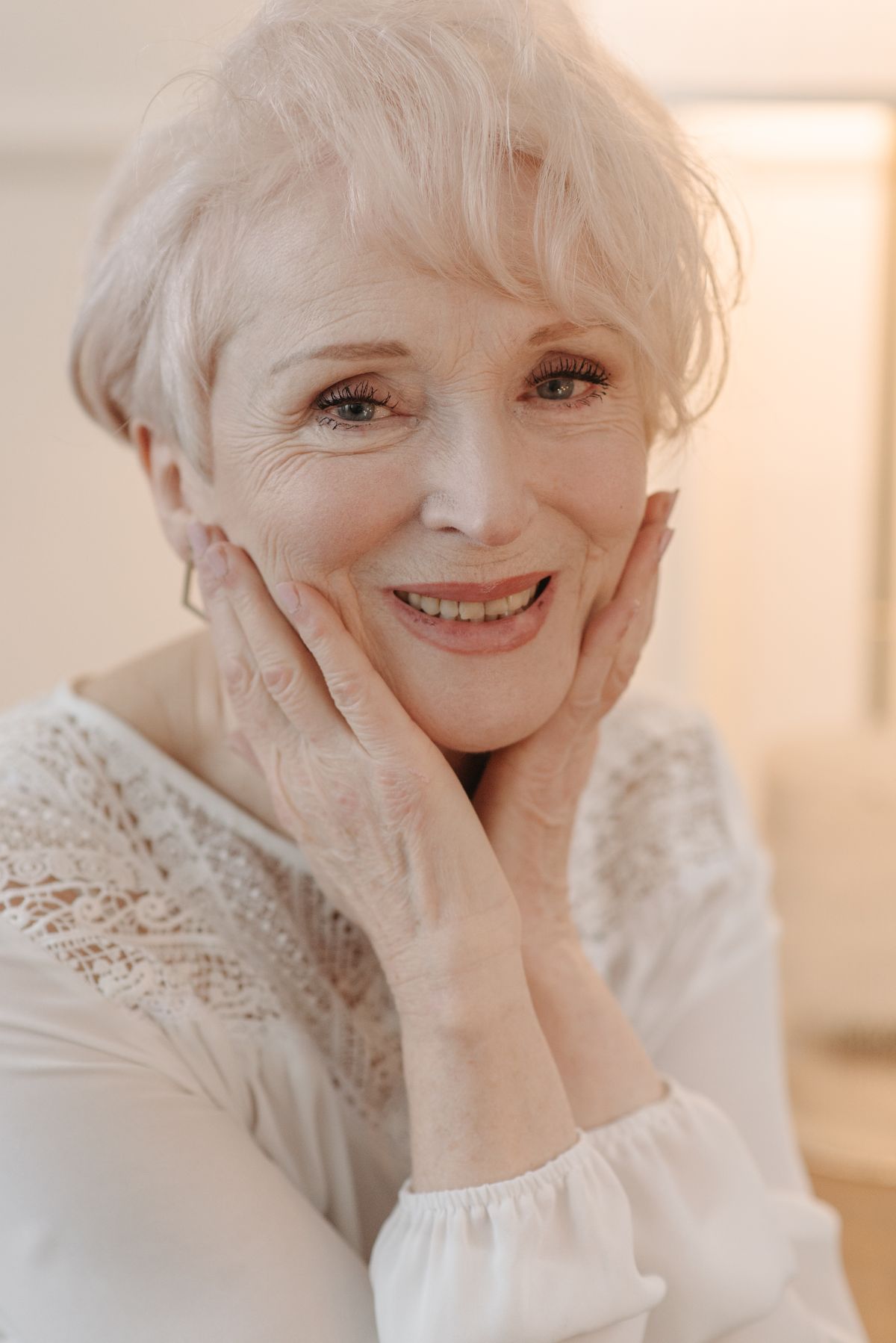 Illustrative senior woman smiling indoors