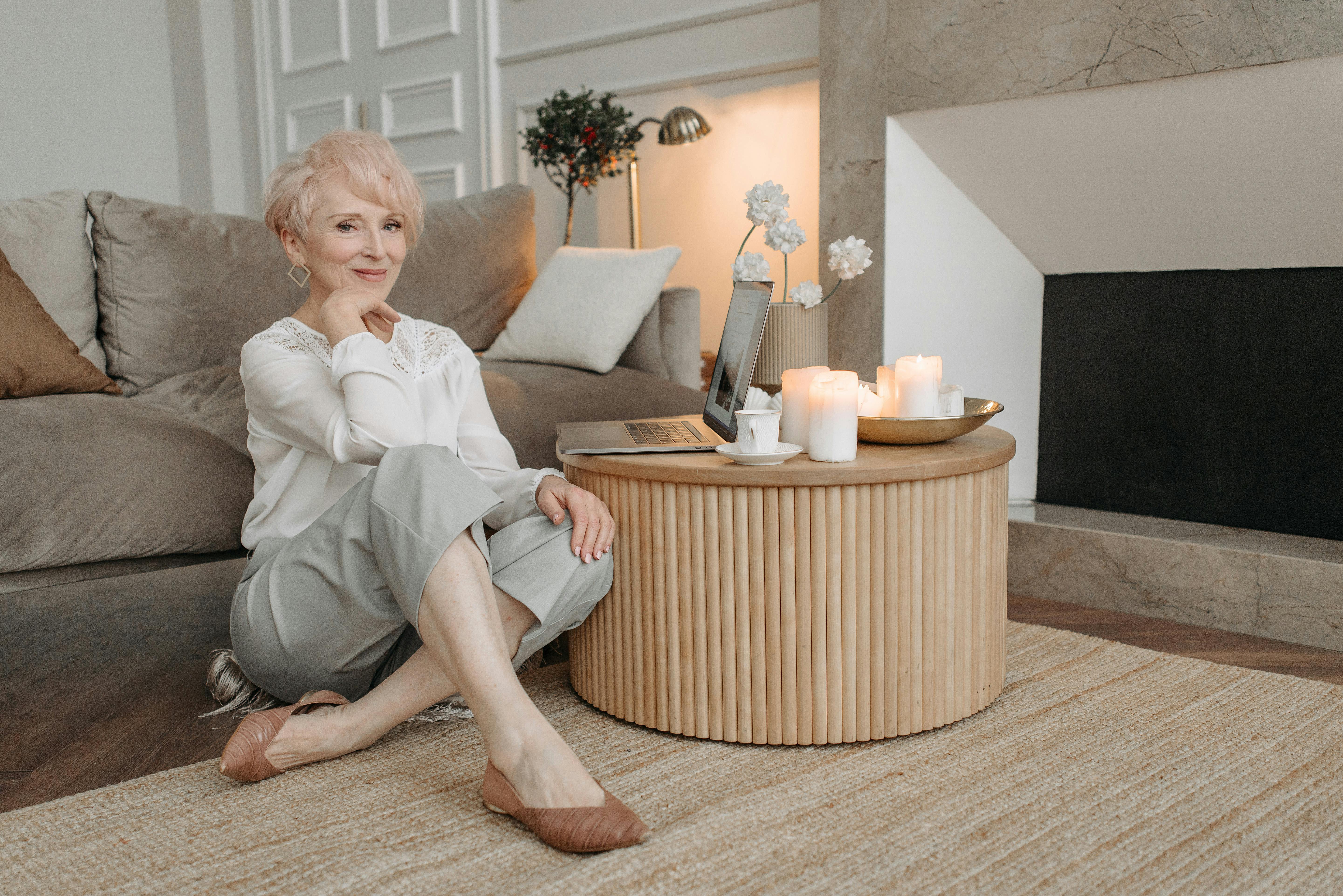 woman in white dress shirt sitting on the floor