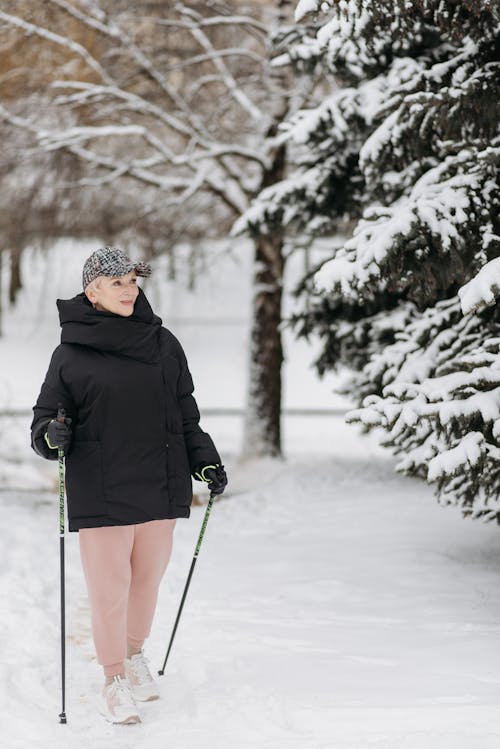 An Elderly Woman Hiking during Winter