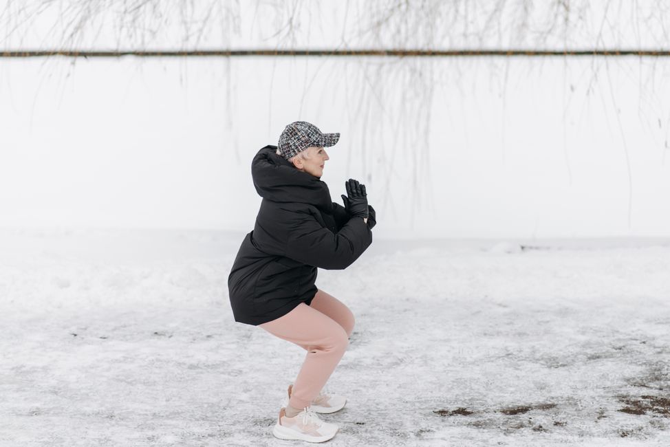 elderly person stretching outdoors