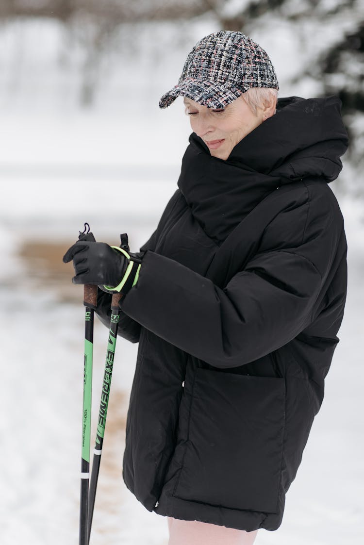 Woman Wearing Winter Jacket And A Cap