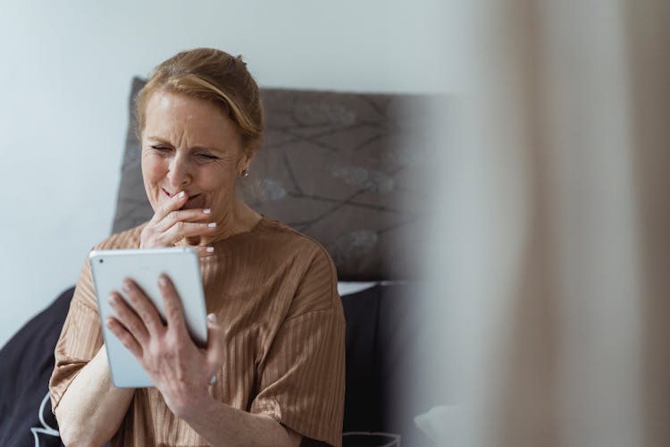 Positive Mature Woman Having Video Call