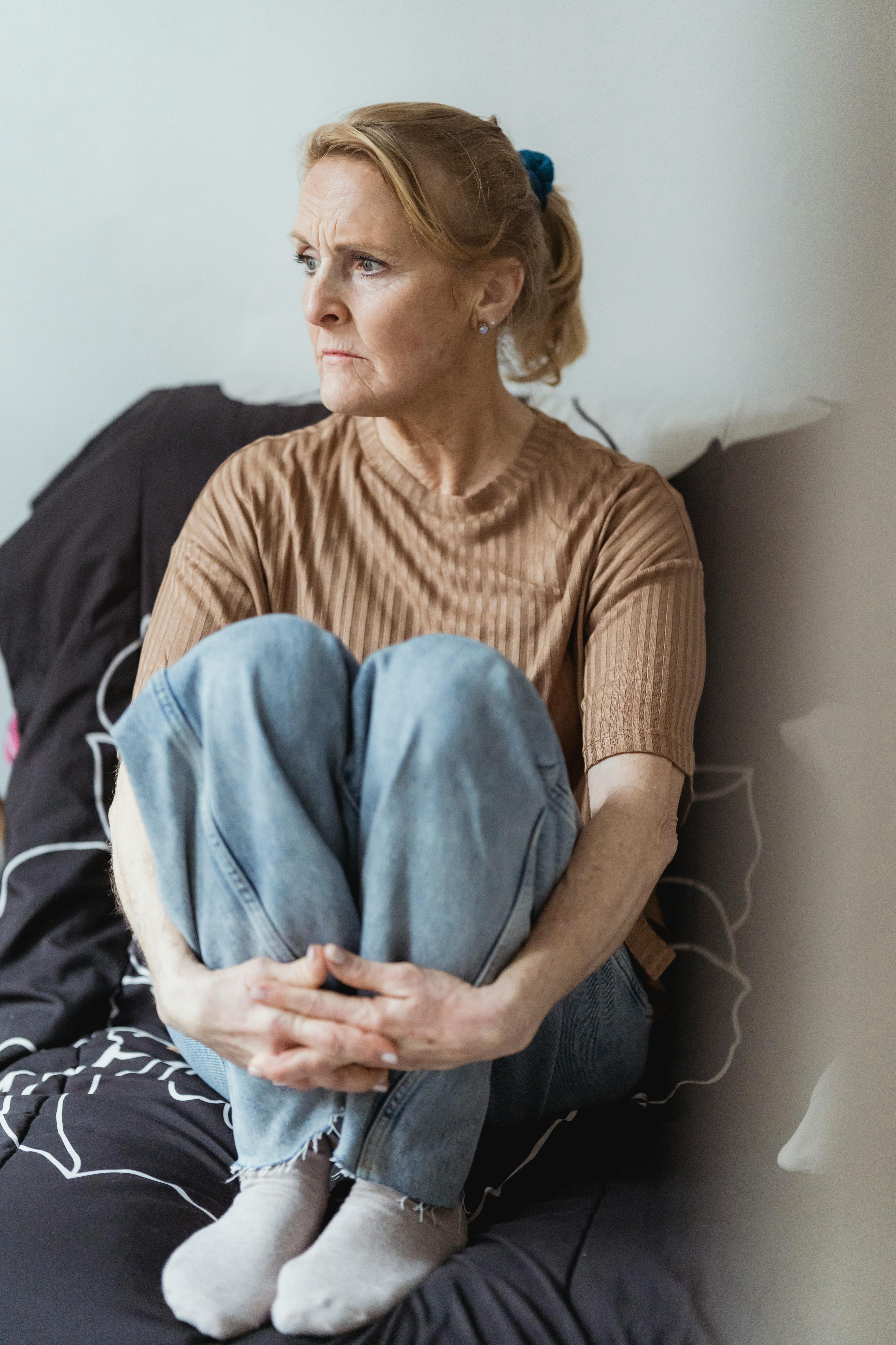 serious mature woman on couch