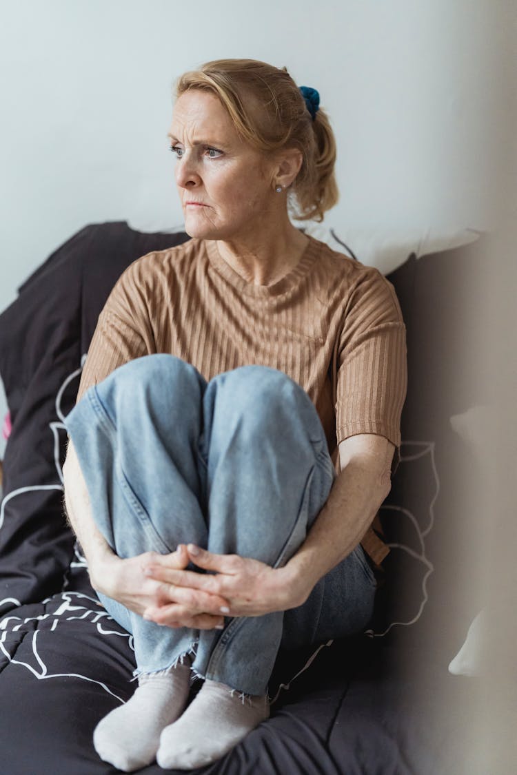 Serious Mature Woman On Couch