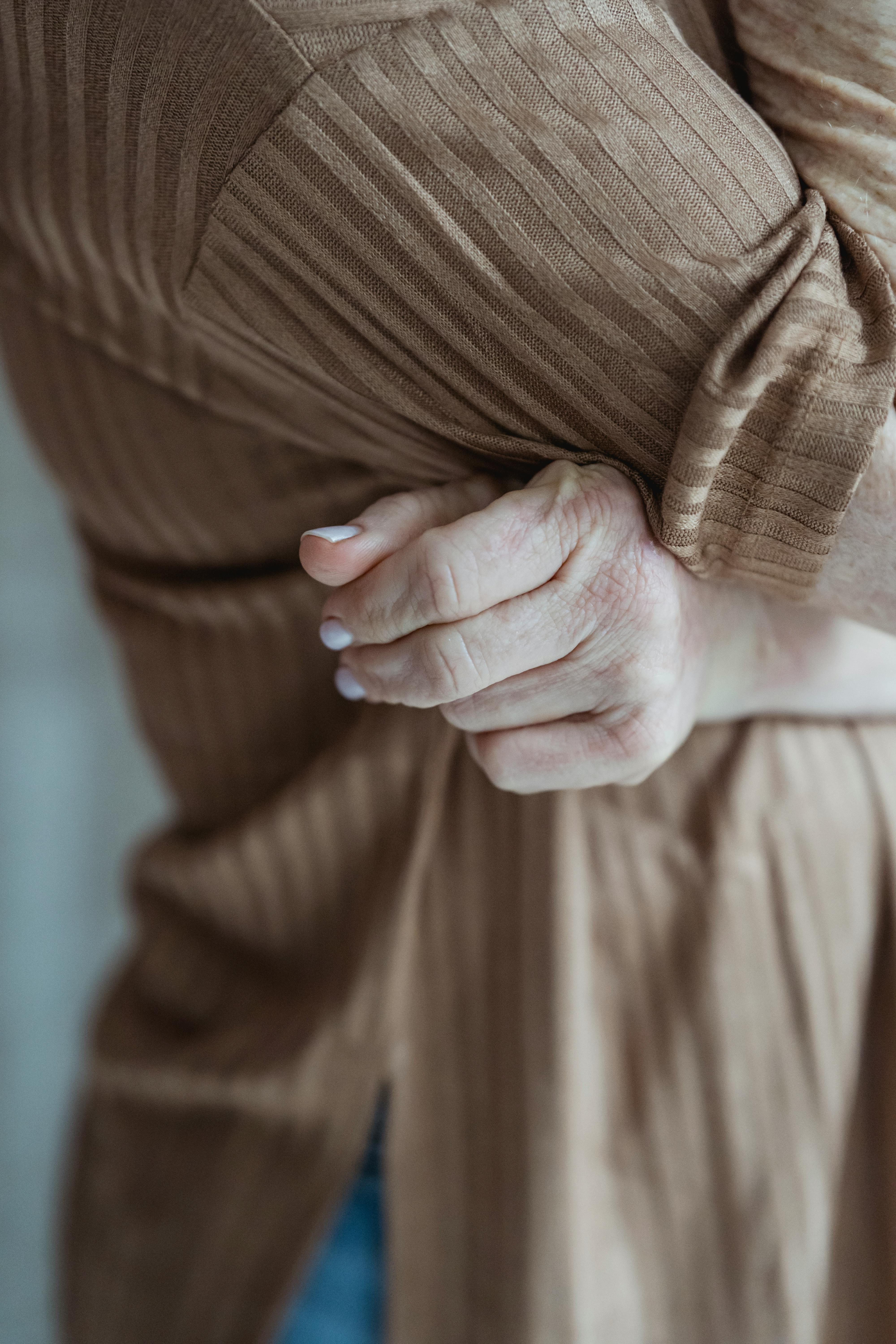 anonymous woman in brown garment