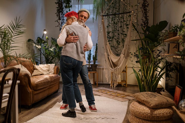 Photograph Of An Elderly Couple Dancing In Their Living Room