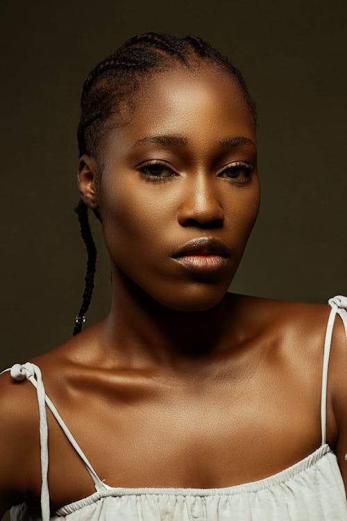 Portrait of a Woman with Afro Braids Looking at the Camera