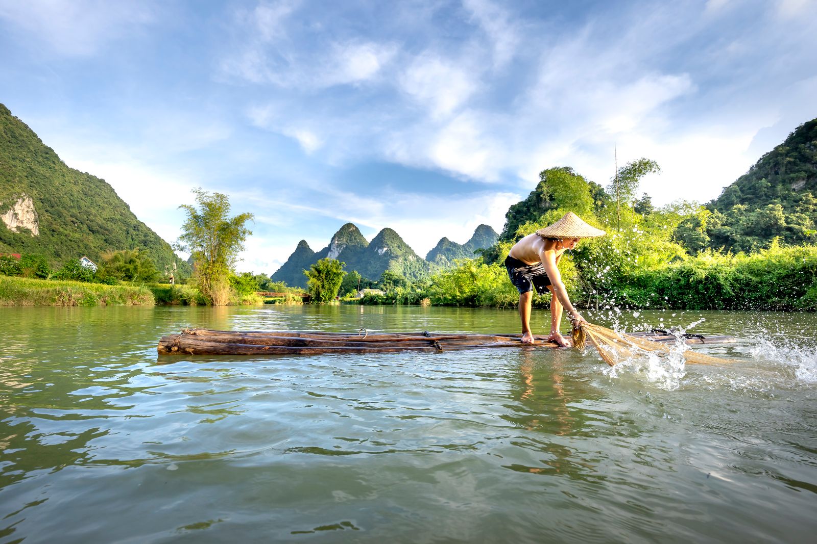 Bamboo rafting Yulong River Yangshuo karst peaks morning mist