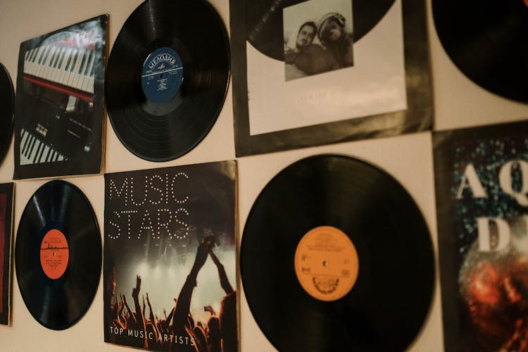 A Vinyl Records And Albums Hanging On A Wall