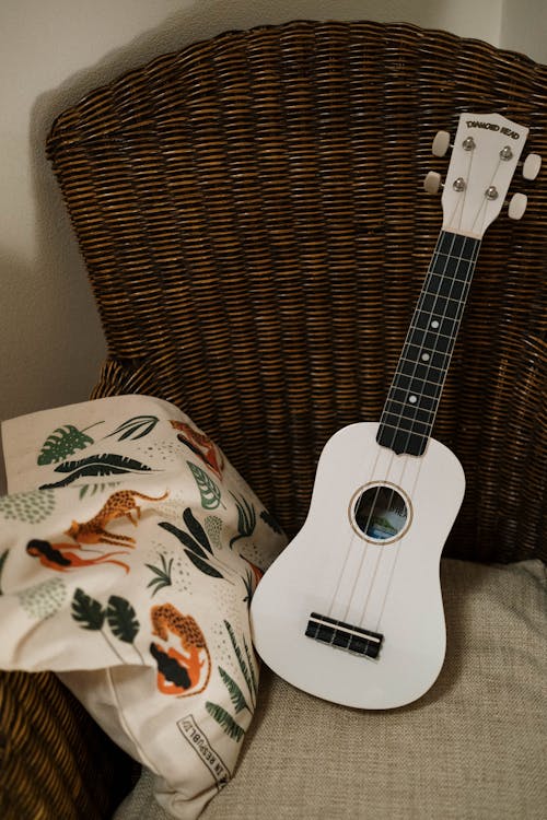 A Guitar over the Rattan Chair