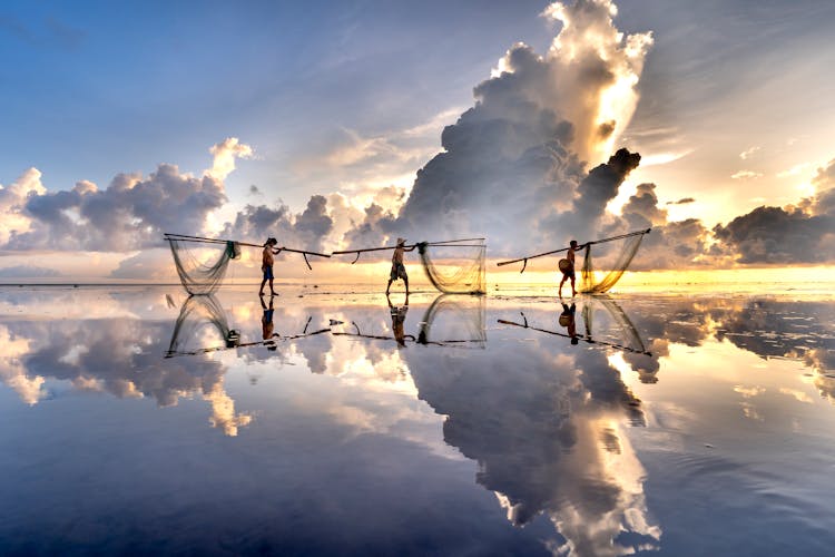 Fishermen Carrying Nets