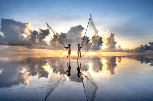 Men with Fishing Nets on Water