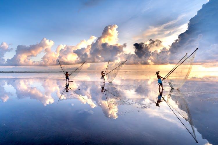 Men Holding Nets For Catching Fish