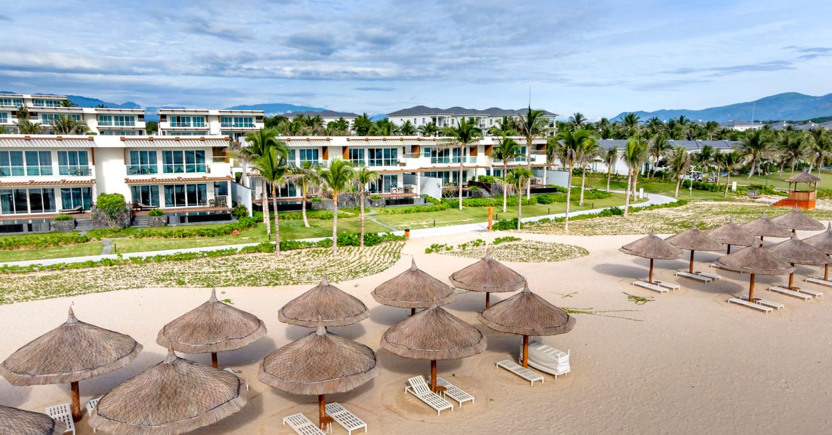 Explore a luxurious beachfront resort with villas and tropical vibes in Vietnam.