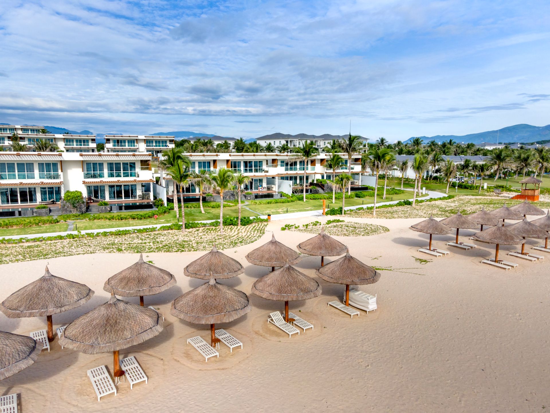 Explore a luxurious beachfront resort with villas and tropical vibes in Vietnam.