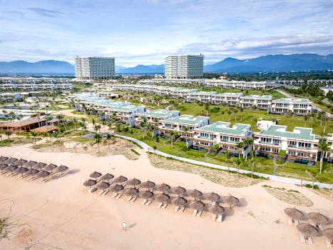 Aerial view of luxury beachside villas and resort in Vietnam, perfect for a tropical getaway.